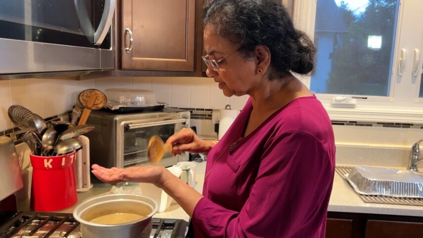 Nala tasting her payasam to make sure the tapioca has fully cooked.