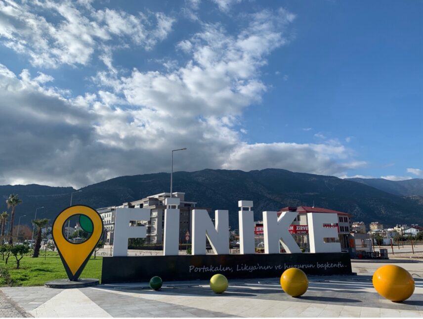 A road sign that says “The capital of Orange, Lycia and Peace”, advertising the most cultivated fruit in the town of Finike.