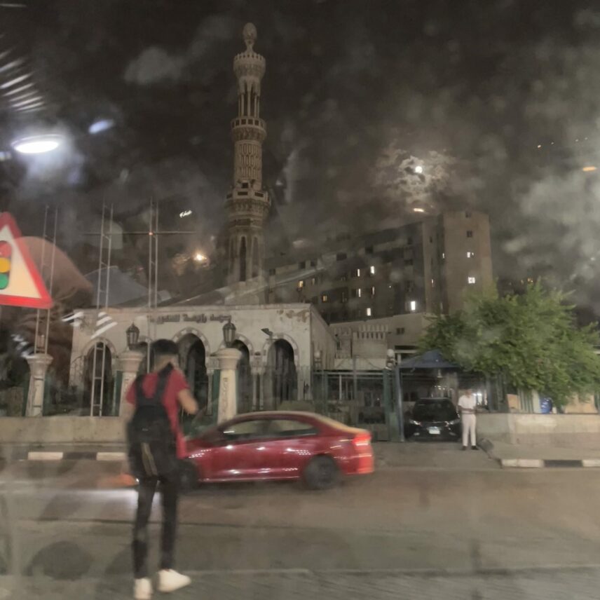 A photograph of the Rabaʾa al-ʿAdawiyya Mosque at night.