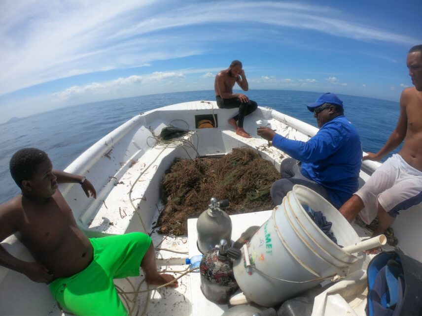 Photograph of ghost net being transported back to shore.