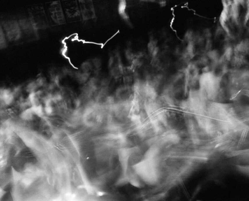 Black and white photo of a crowd with little individual definition