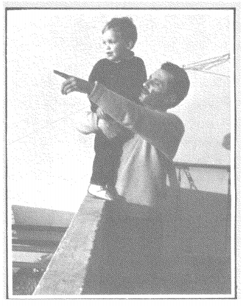 Photograph of a man and a child