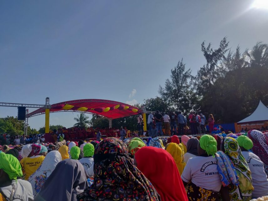 Photograph of a crowd of people outdoors
