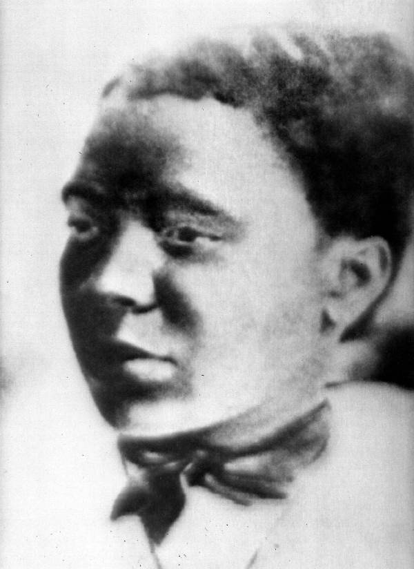 A black and white photograph of a woman that looks vintage