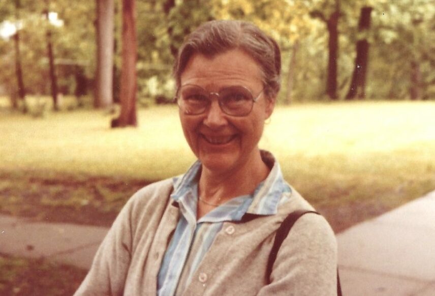 Photograph of a woman outdoors.